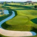 Nemacolin Enters Golf Digest’s Top 15 Best Golf Resorts List Lush golf course with winding fairways.