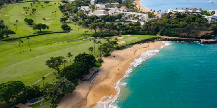Kā'anapali Golf Courses Maui Open for Play Lush golf course beside stunning coastline.