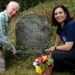 Ashton-on-Mersey Golfers Honour Ryder Family Legacy Two people tending to a gravestone.