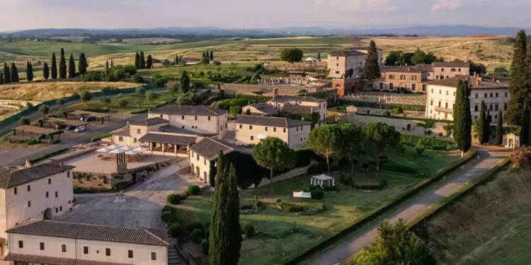 La Bagnaia Golf Resort aerial view showing Tuscan estate buildings and golf course landscape near Siena.